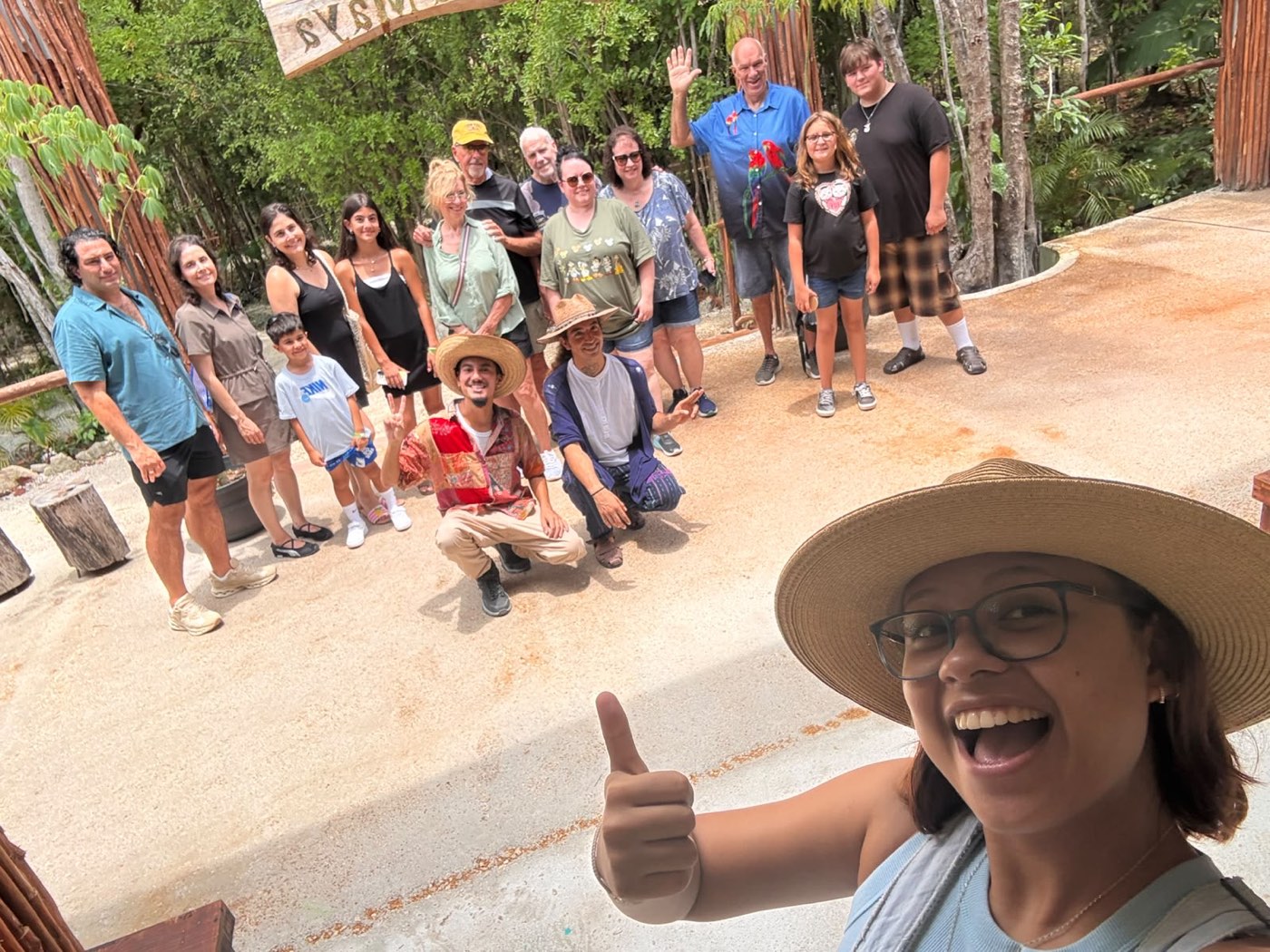 A guide takes a selfie with her whole tour group on arrival