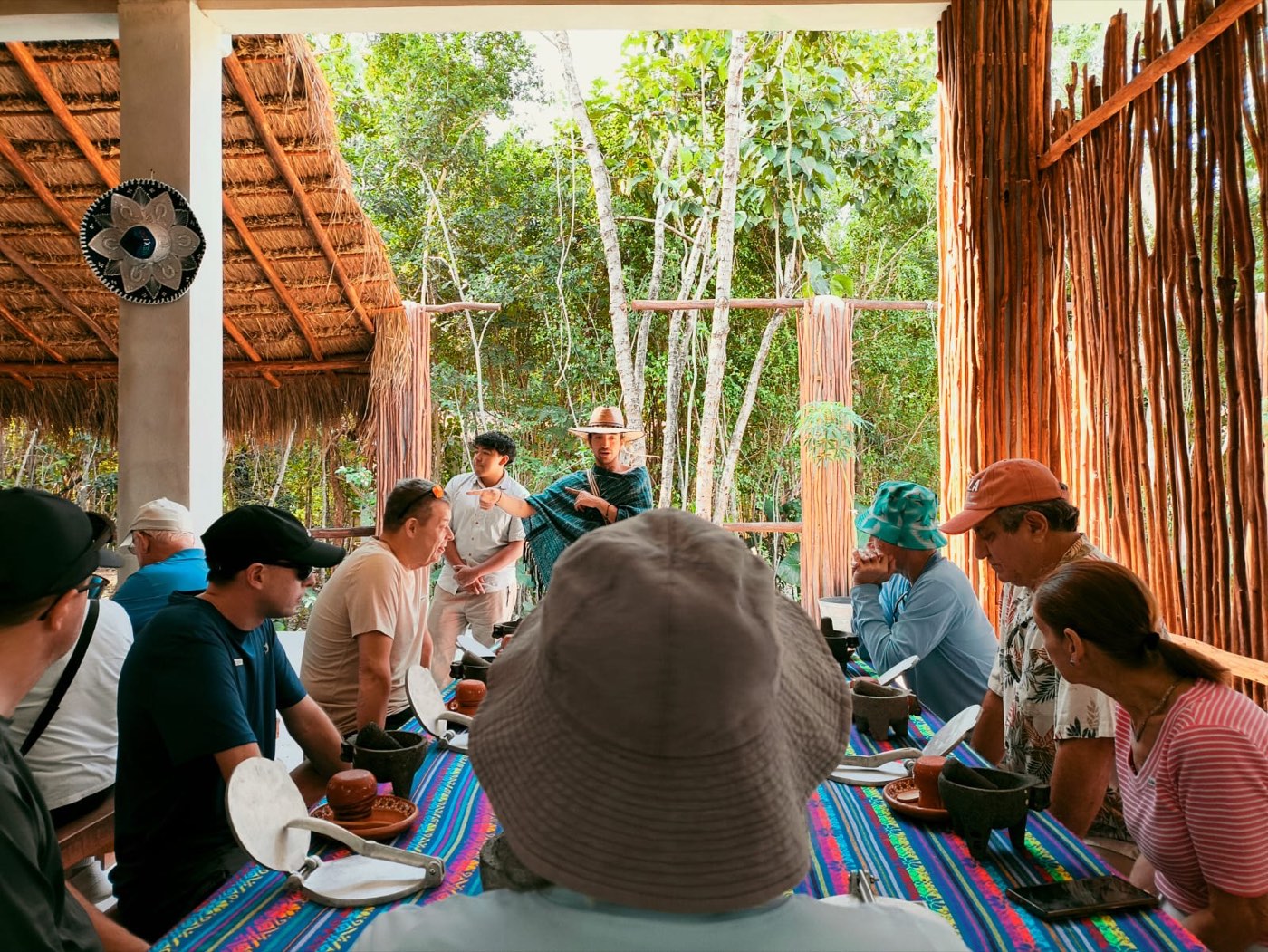 Guests around the long table at Tierra Maya
