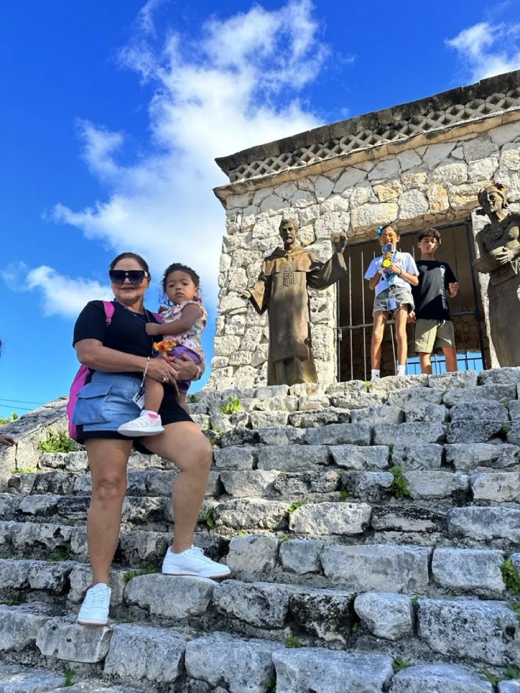 A guest and her granddaughter on the steps at San Gervasio